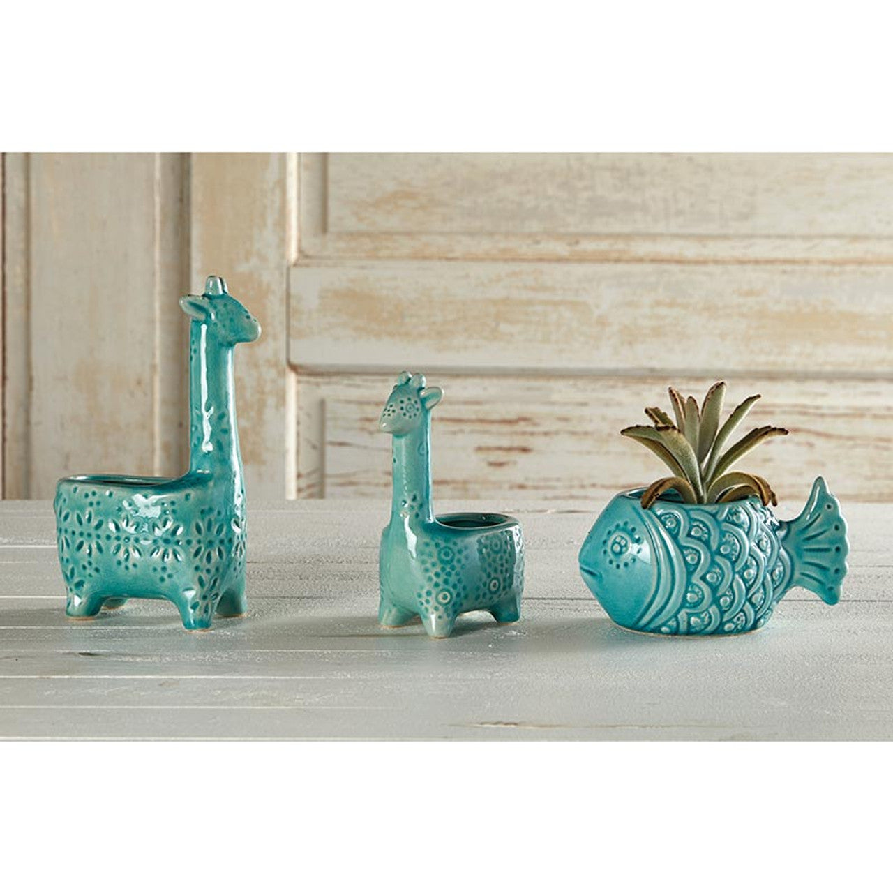 Lake Blue Giraffe Planter, a 6-inch tall ceramic pot shaped like a giraffe, perfect for small succulents and house plants.