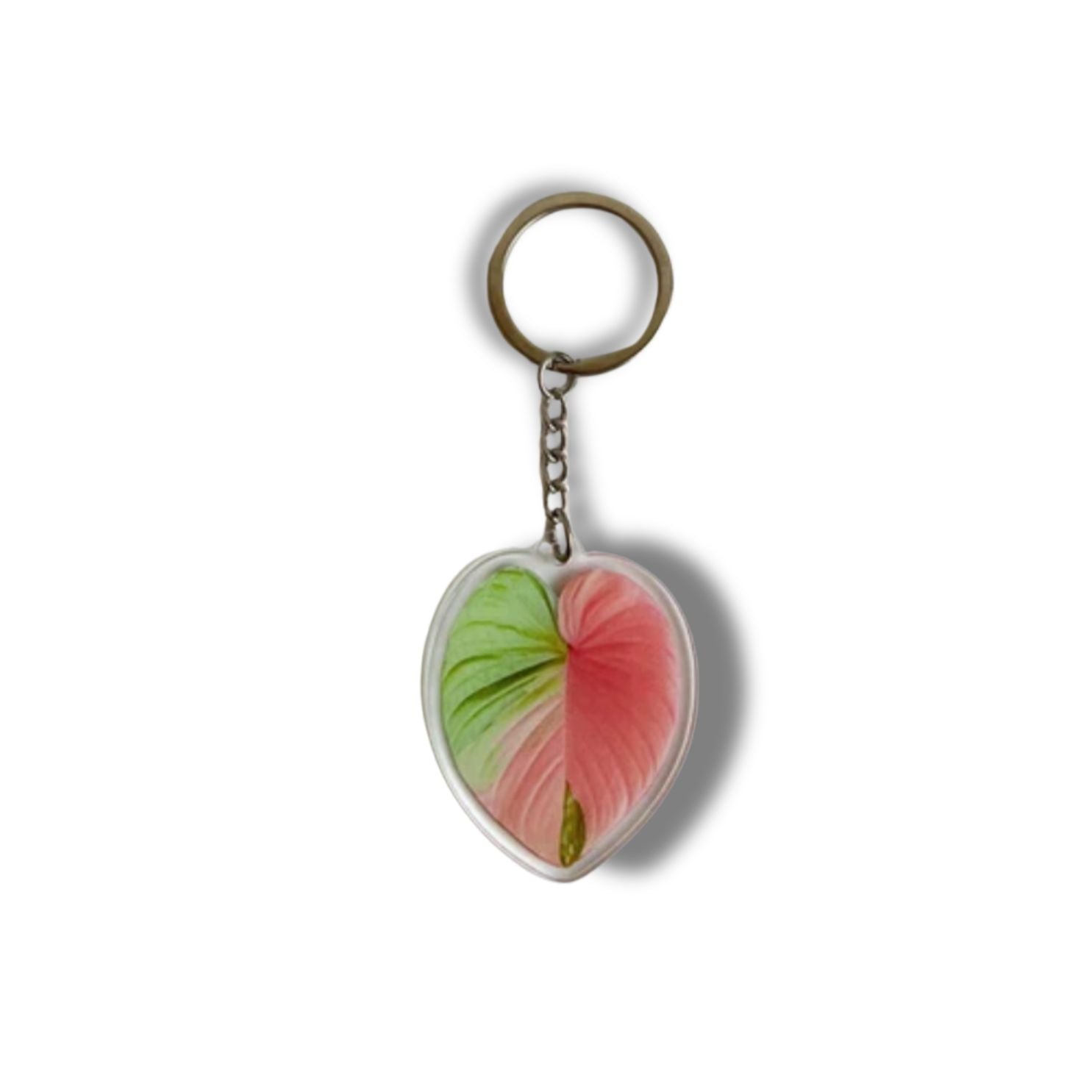 A collection of seven illustrated leaf acrylic keychains displayed on a clear background, showcasing vibrant colors and double-sided designs.