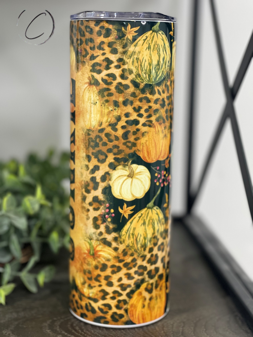 Leopard Pumpkin Junkie 20oz Skinny Tumbler with a vibrant leopard pumpkin design, perfect for stylish hydration.