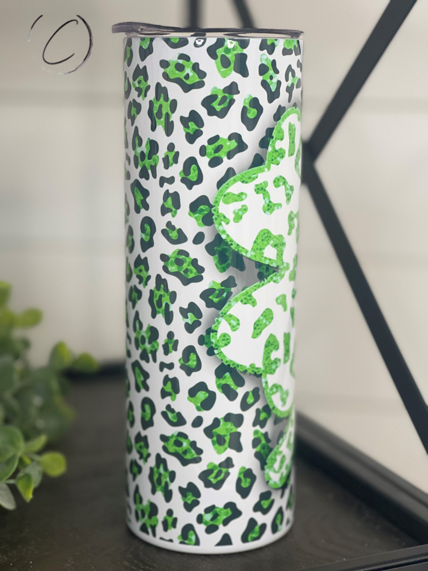 Leopard Shamrock 20oz Skinny Tumbler featuring a vibrant leopard and shamrock design, perfect for hot and cold beverages.