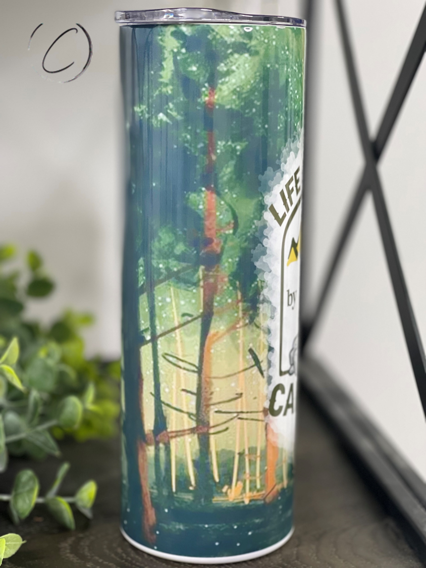 Life Is Better By The Campfire 20oz Skinny Tumbler with a vibrant outdoor-themed design, perfect for camping and outdoor activities.