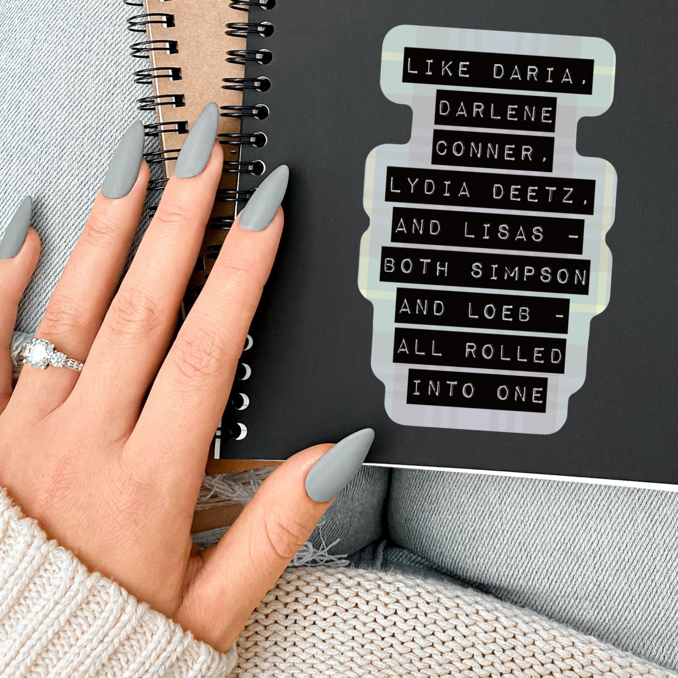 A colorful sticker featuring iconic '90s characters Daria, Darlene Conner, Lydia Deetz, and Lisas Simpson and Loeb on a grunge flannel background.