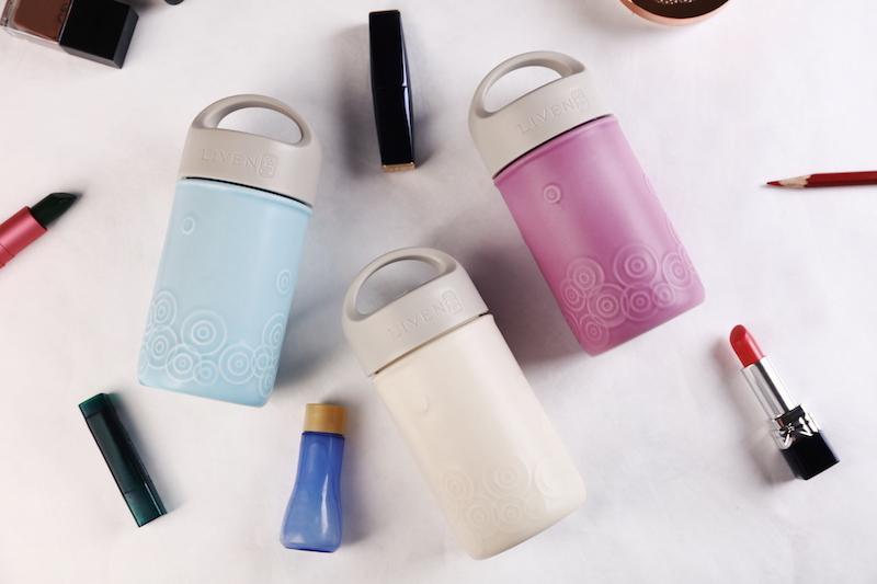 Liven Destiny Travel Mug featuring a tourmaline ceramic body, silicone cover, and convenient carrying handle, perfect for on-the-go hydration.