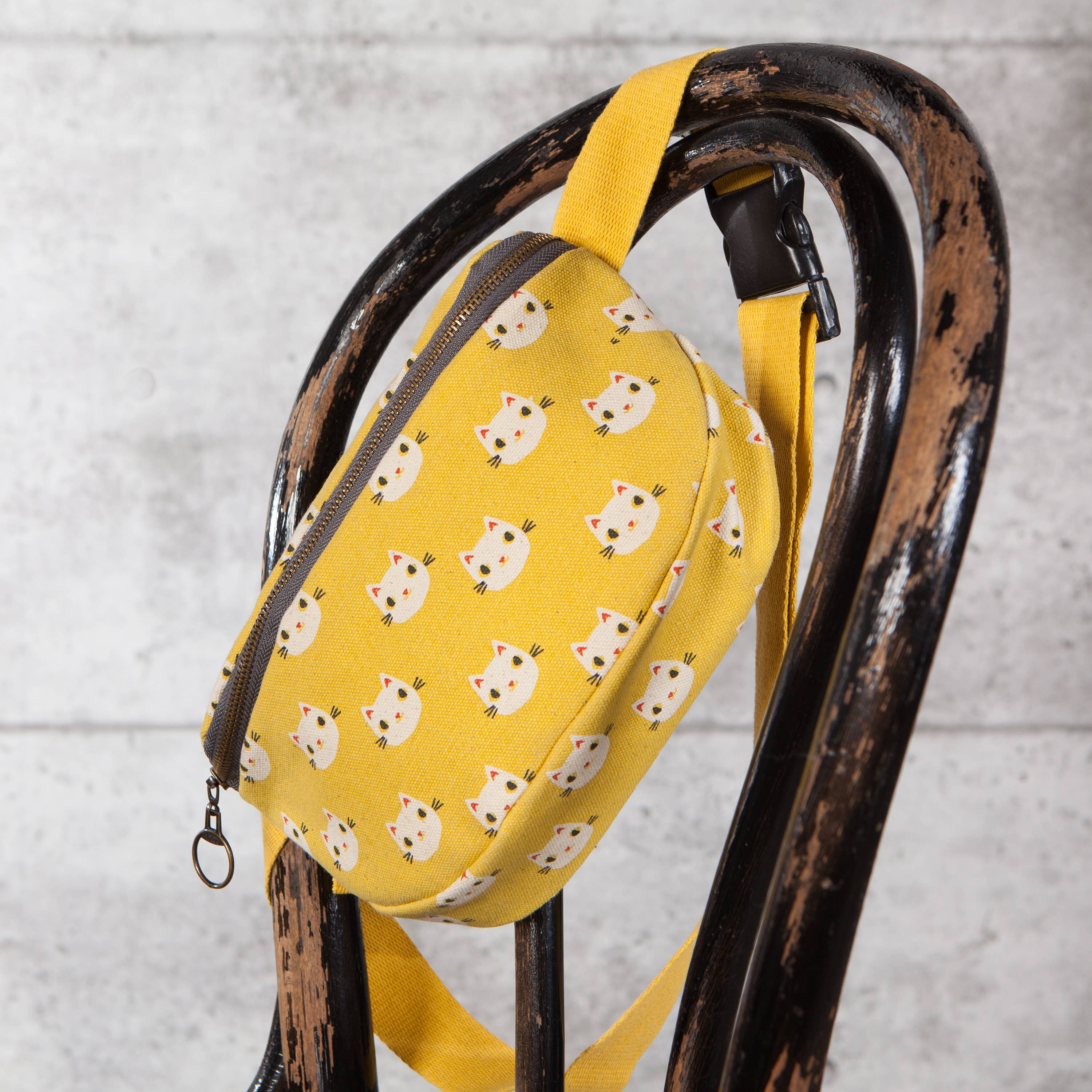 Meow Meow Cats Cotton Hip Bag in yellow with playful cat designs, featuring an adjustable strap and zip compartments.