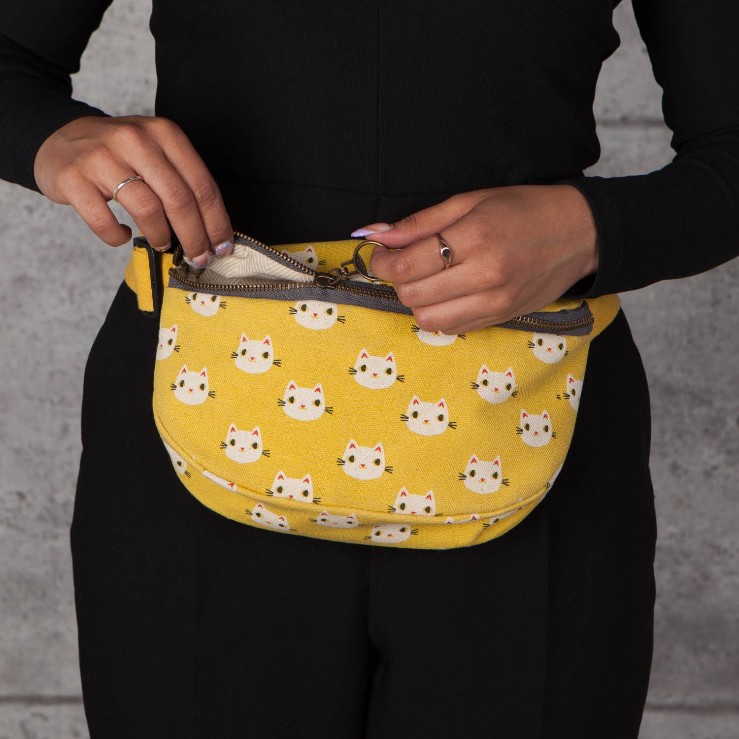 Meow Meow Cats Cotton Hip Bag in yellow with playful cat designs, featuring an adjustable strap and zip compartments.