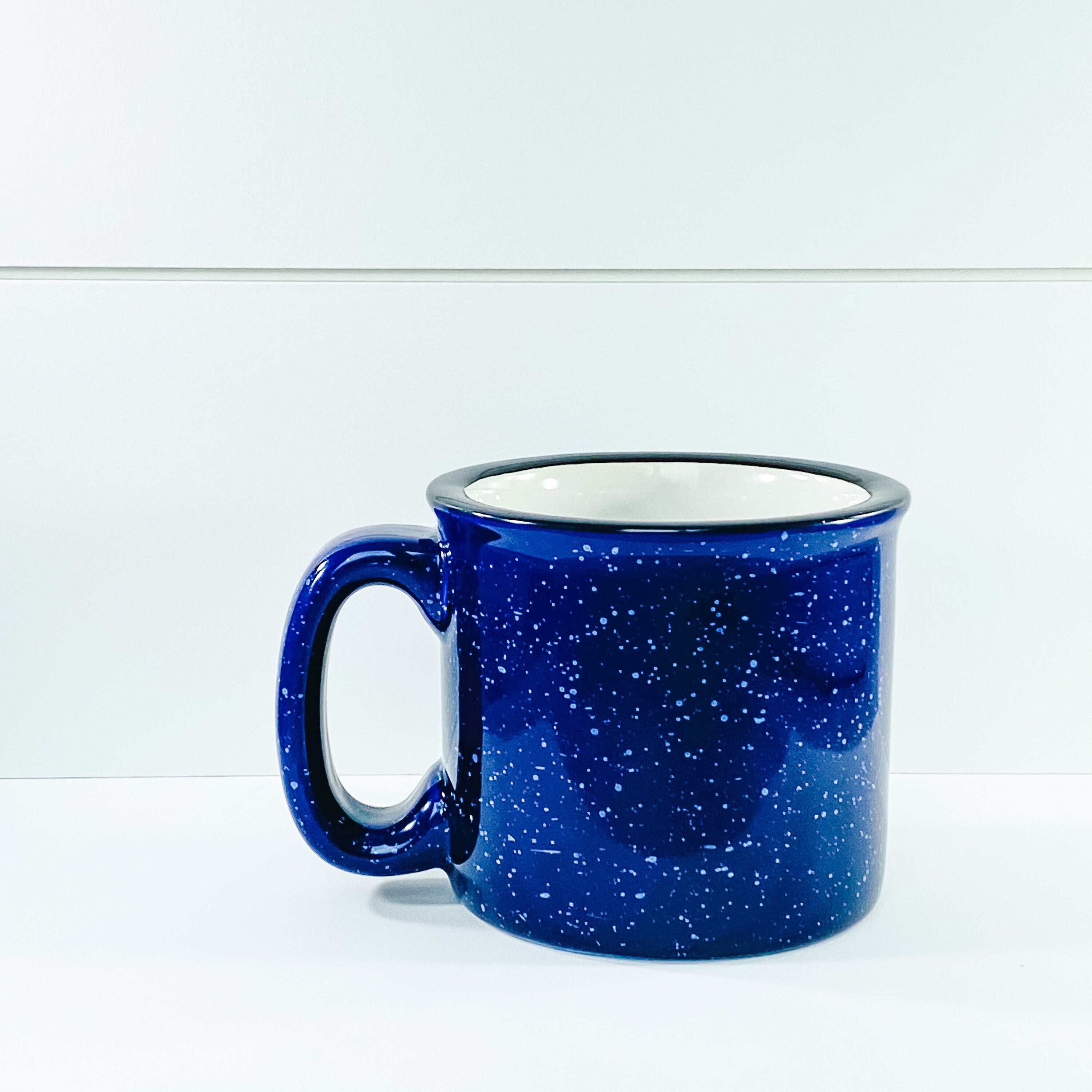 Merry And Bright Campfire Mug with vibrant design, perfect for cozy beverages.