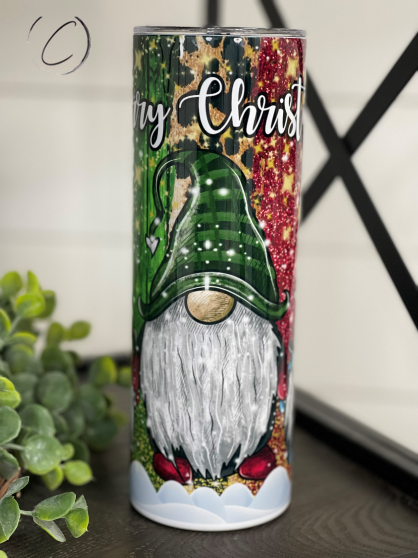 Merry Christmas Gnomes 20oz Skinny Tumbler featuring festive gnome design, reusable straw, and durable construction.