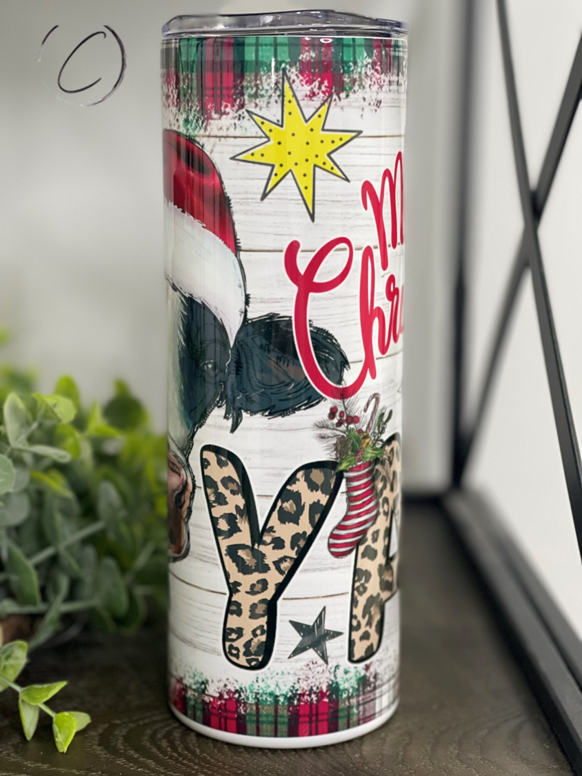 Merry Christmas Y'all Heifer 20oz Skinny Tumbler with festive design and reusable straw.