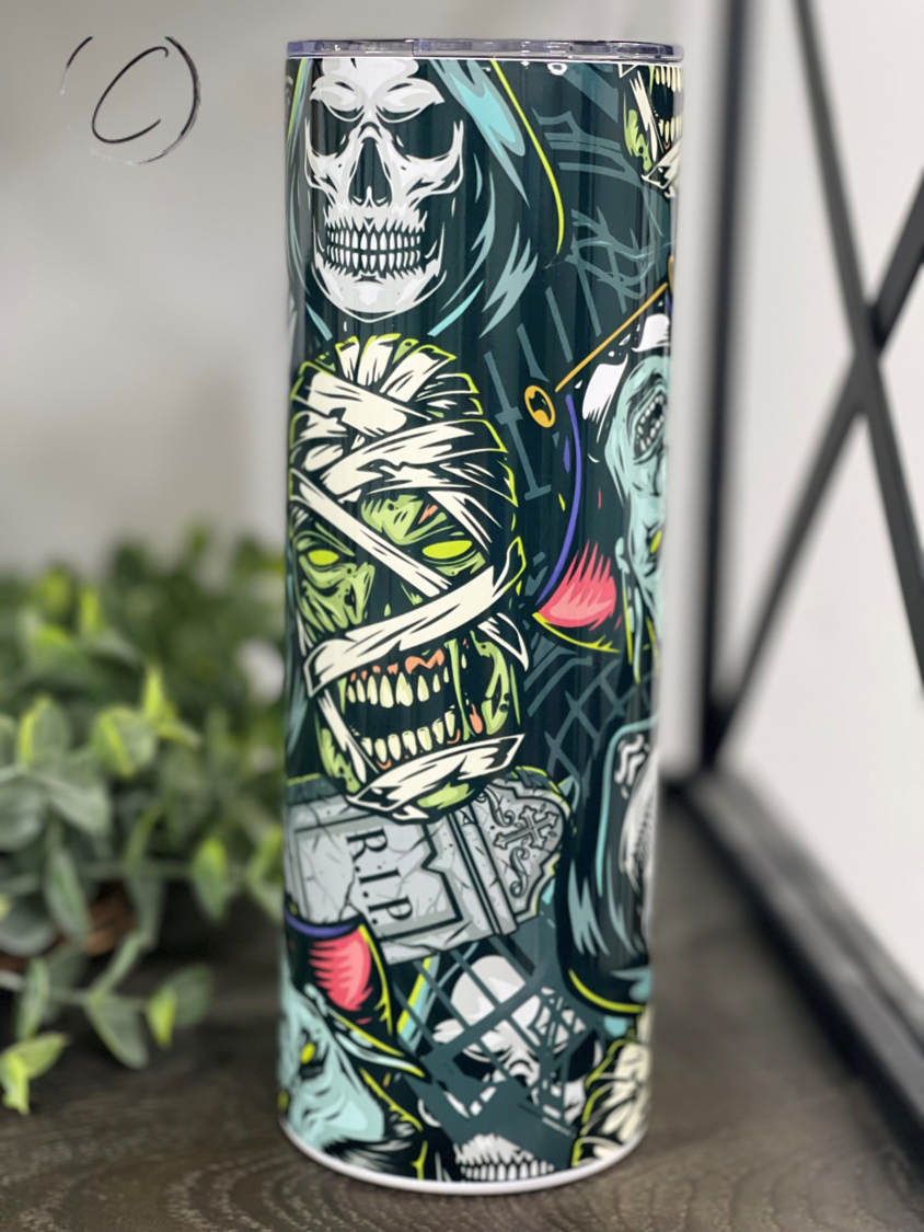 Monsters 20oz Skinny Tumbler featuring a vibrant full wrap design, ideal for hot and cold beverages.