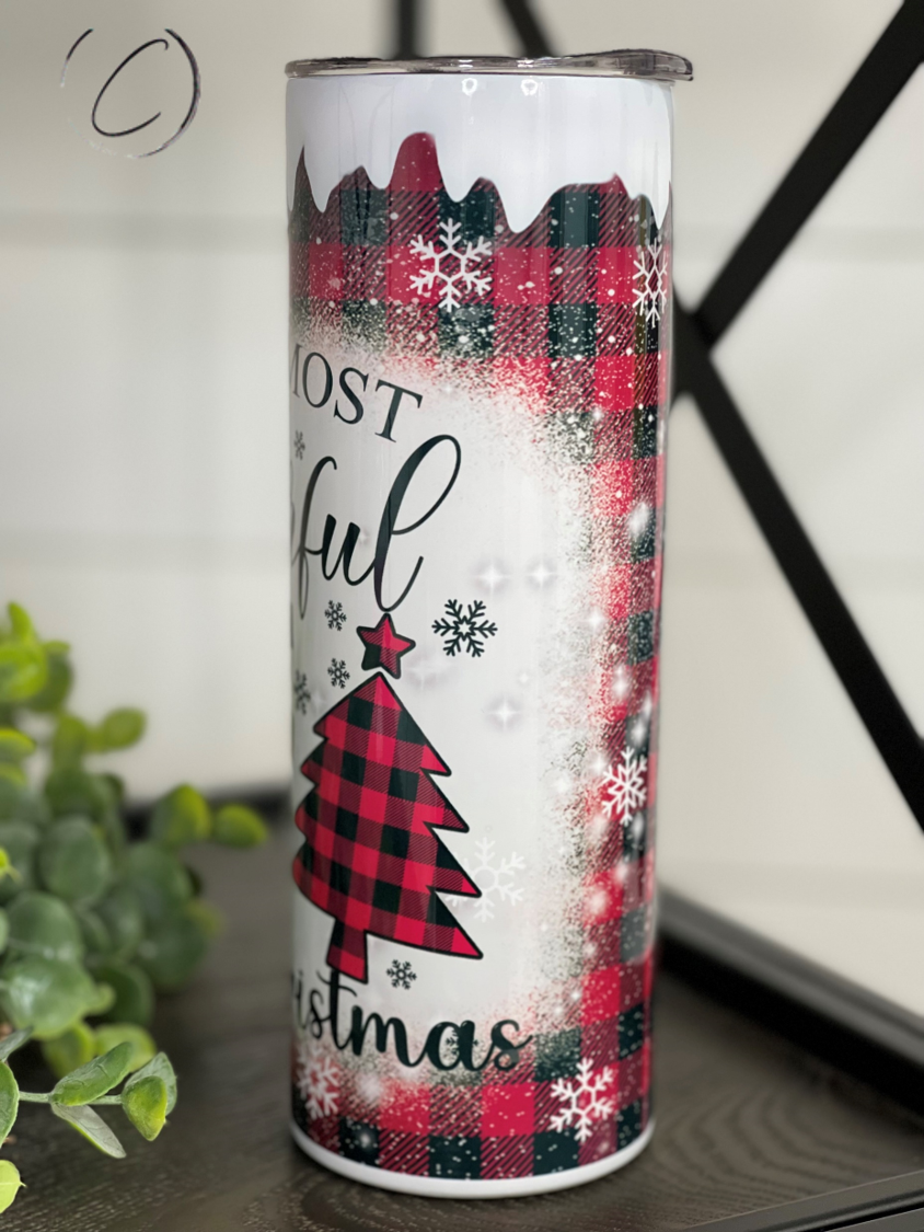A stylish 20oz skinny tumbler featuring a buffalo plaid design, perfect for hot and cold beverages, includes a reusable straw.