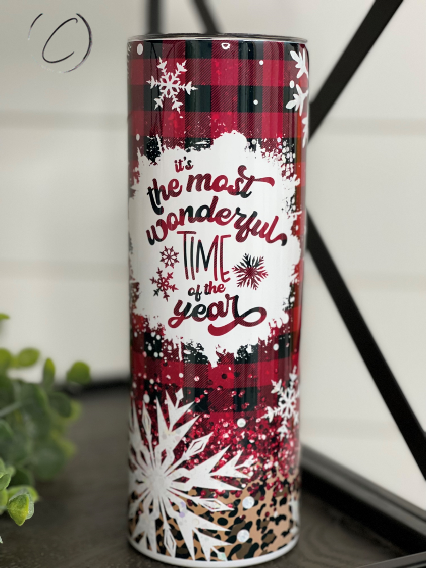 A stylish 20oz skinny tumbler featuring a leopard and plaid design, perfect for hot and cold beverages, with a reusable straw included.