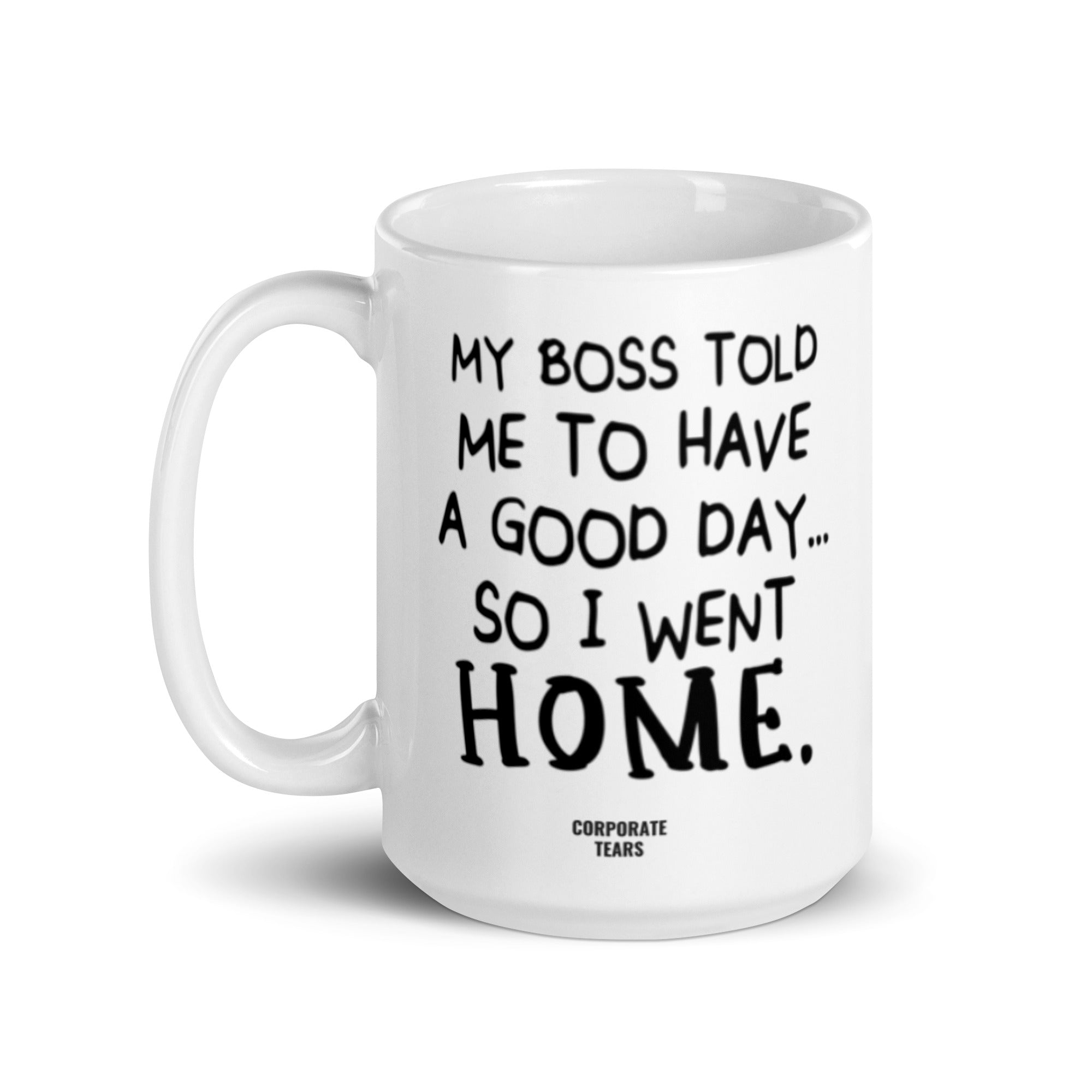 A humorous ceramic mug with the quote 'My Boss Told Me To Have A Good Day So I Went Home' printed on both sides, showcasing its glossy finish.