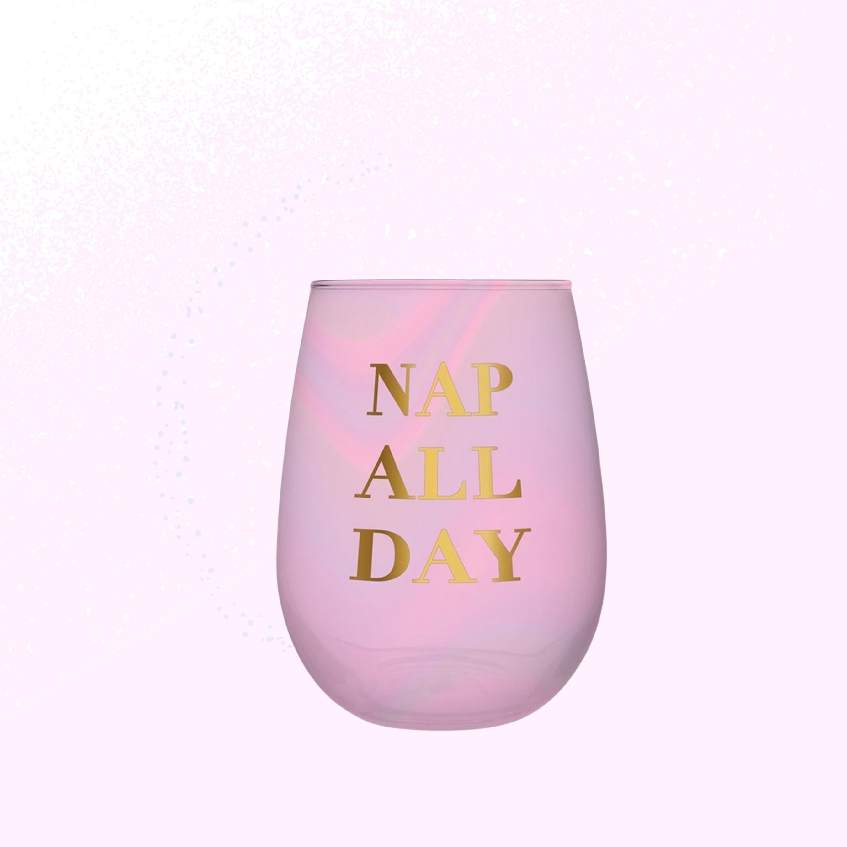 Iridescent pink stemless wine glass with gold 'Nap All Day' lettering, perfect for stylish sipping.