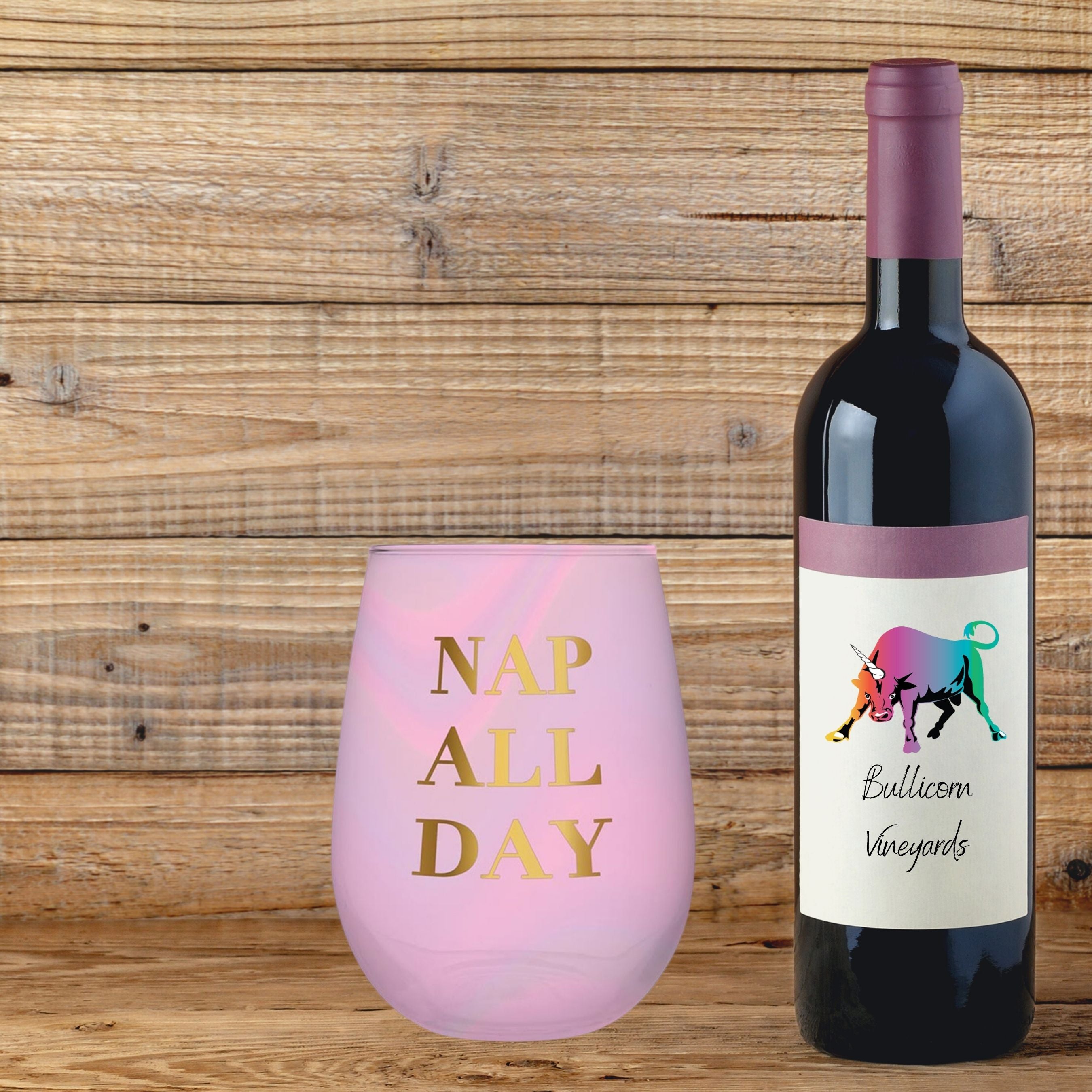 Iridescent pink stemless wine glass with gold 'Nap All Day' lettering, perfect for stylish sipping.