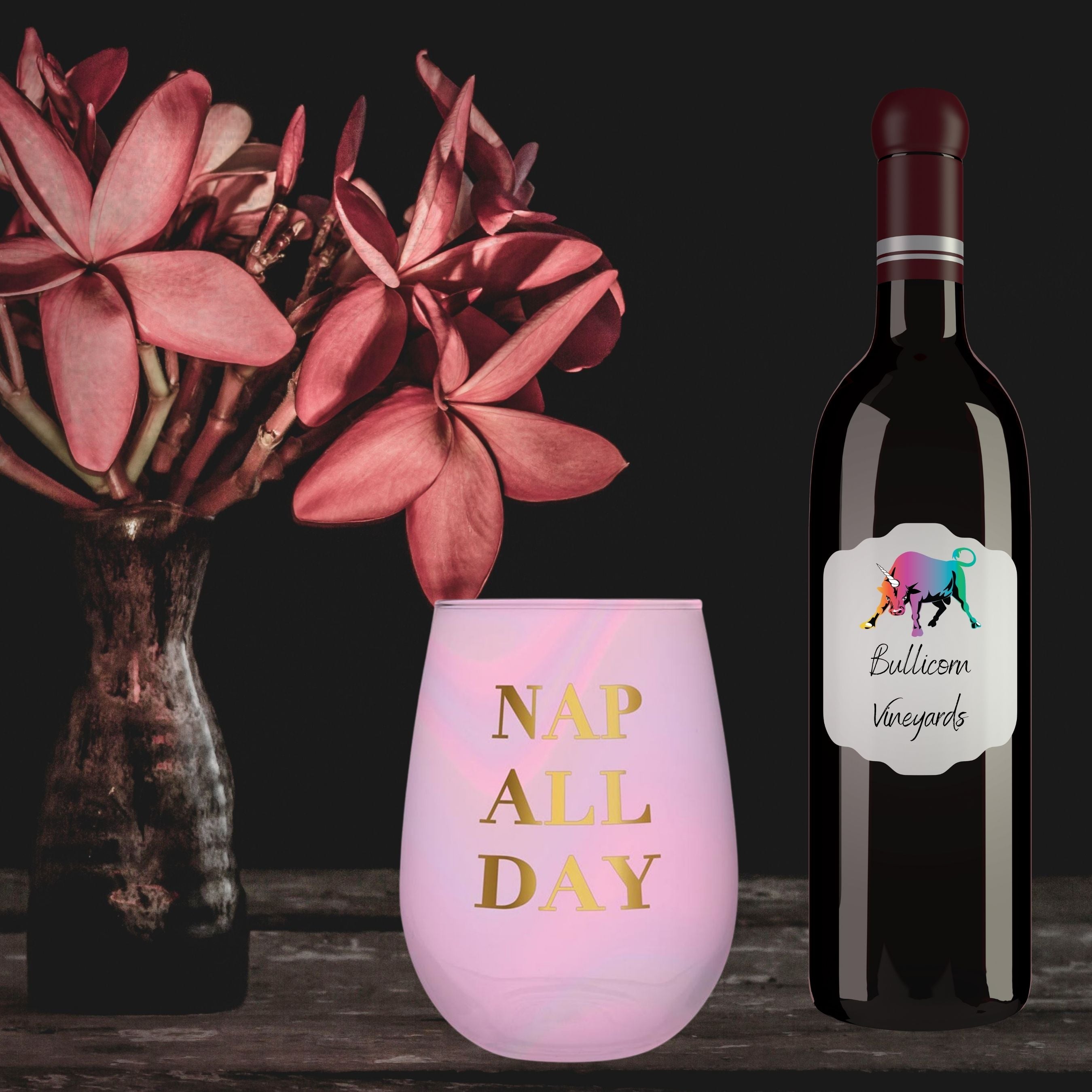 Iridescent pink stemless wine glass with gold 'Nap All Day' lettering, perfect for stylish sipping.
