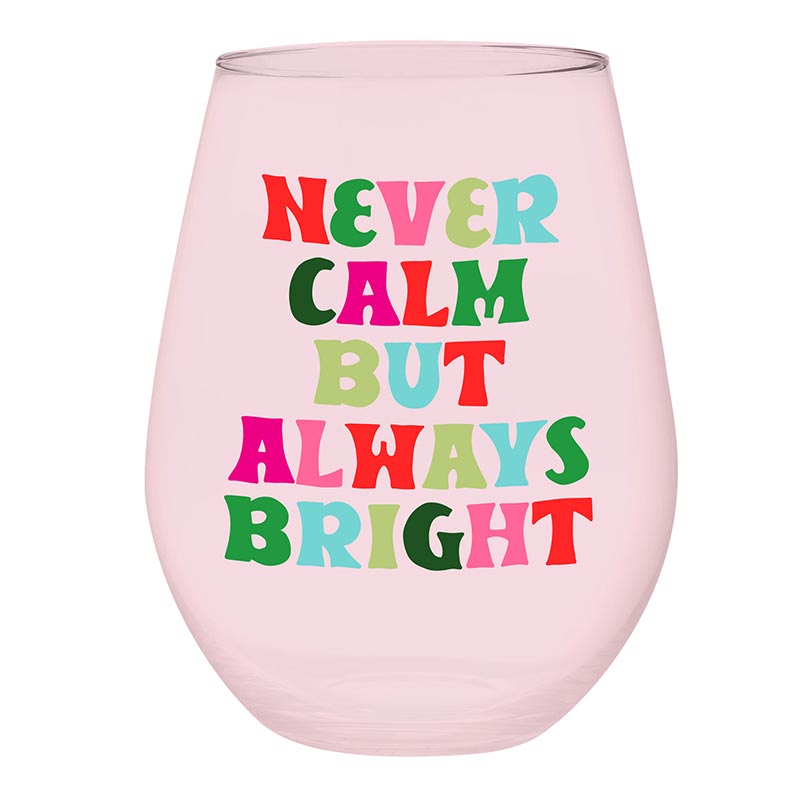 A pastel pink jumbo stemless wine glass with multicolored lettering that reads 'Never Calm But Always Bright', perfect for wine lovers.