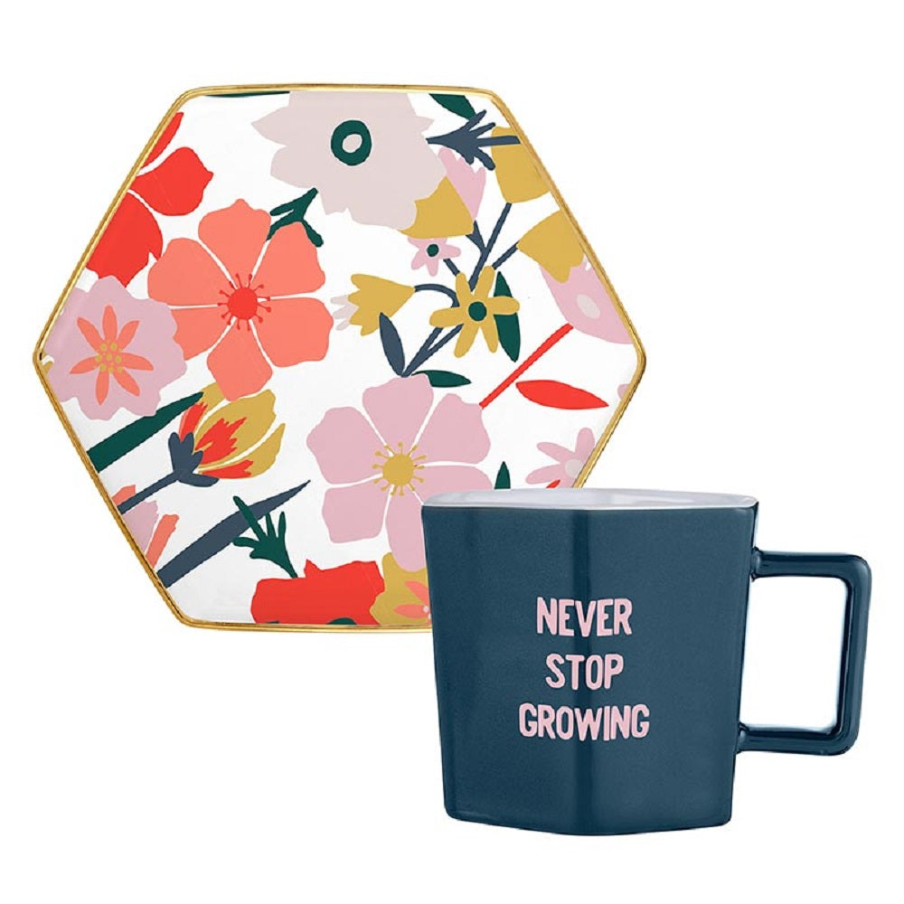 Never Stop Growing Hexagon Mug and Saucer Set featuring a floral design, perfect for stylish sipping.
