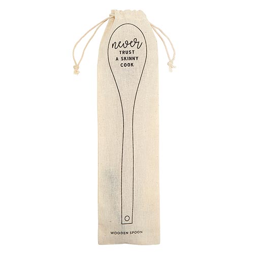 A wooden cooking spoon with the phrase 'Never Trust A Skinny Cook' engraved, placed in a stylish canvas gift bag.