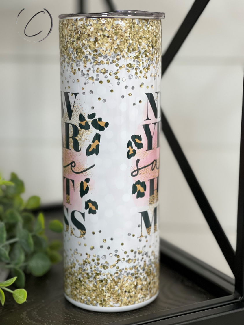 A stylish 20oz skinny tumbler featuring the phrase 'New Year Same Hot Mess' with a vibrant full wrap design, perfect for hot and cold beverages.