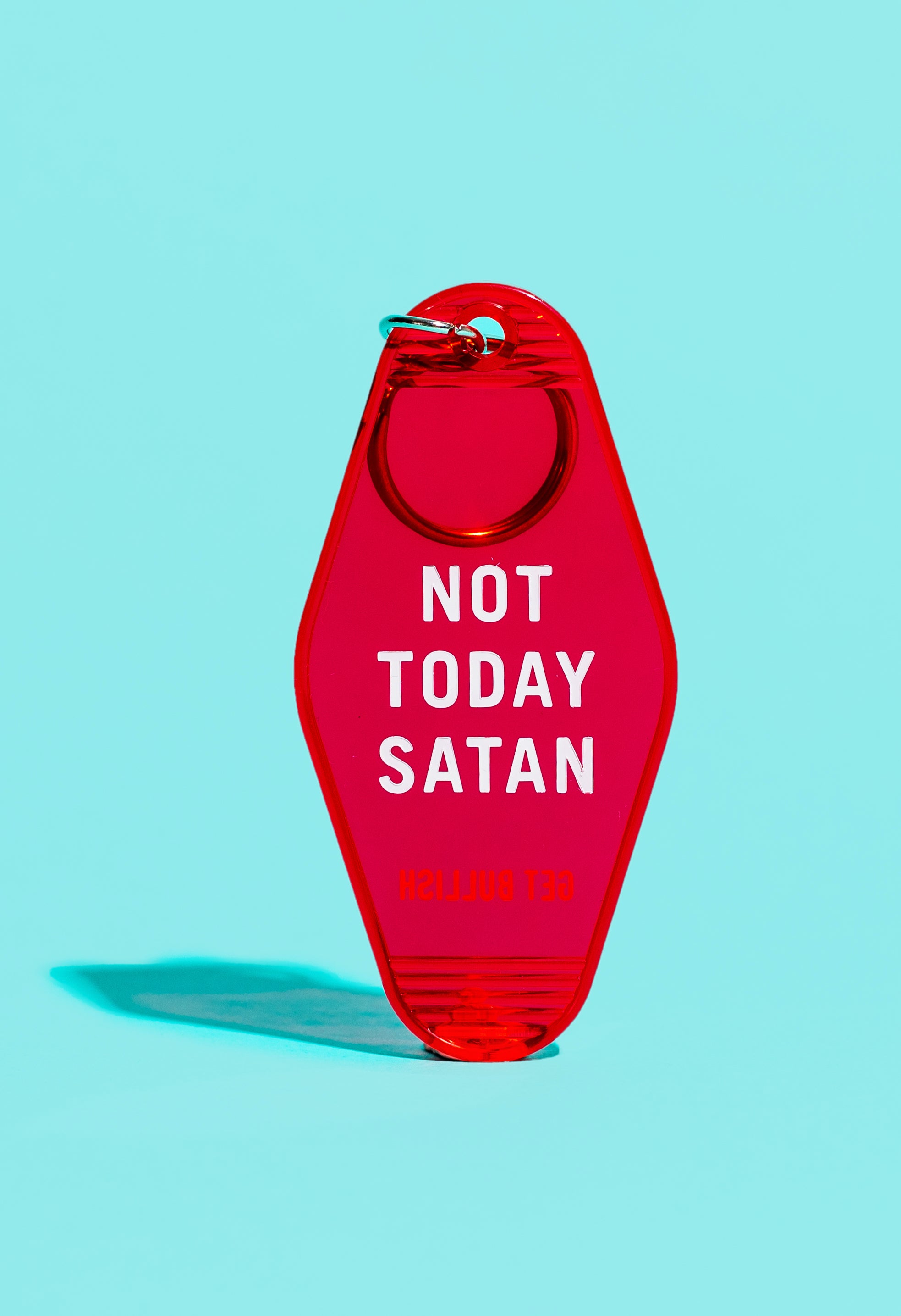 A vibrant red motel style keychain with the phrase 'NOT TODAY SATAN' in white lettering, featuring a classic split ring.