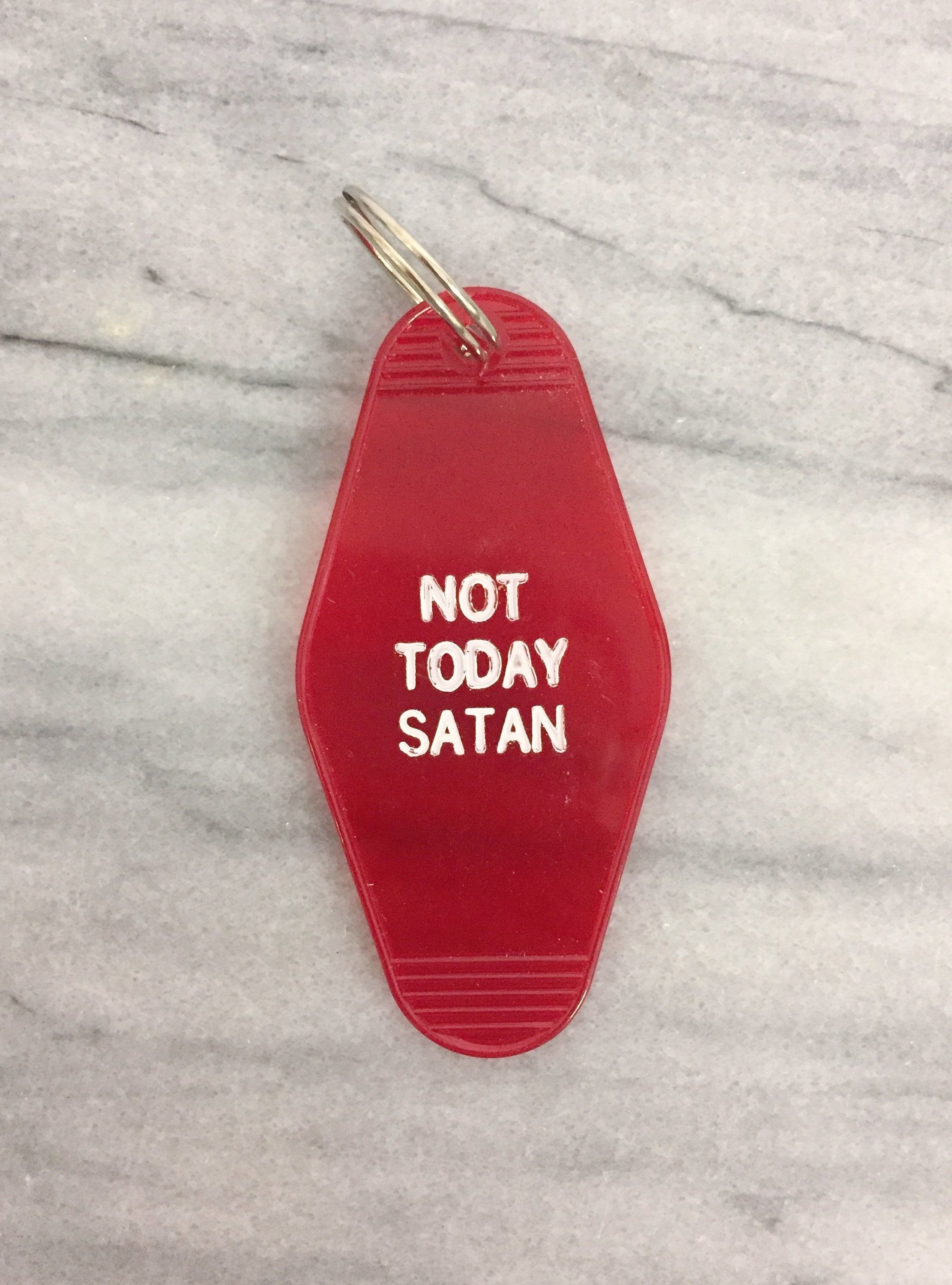 A vibrant red motel style keychain with the phrase 'NOT TODAY SATAN' in white lettering, featuring a classic split ring.