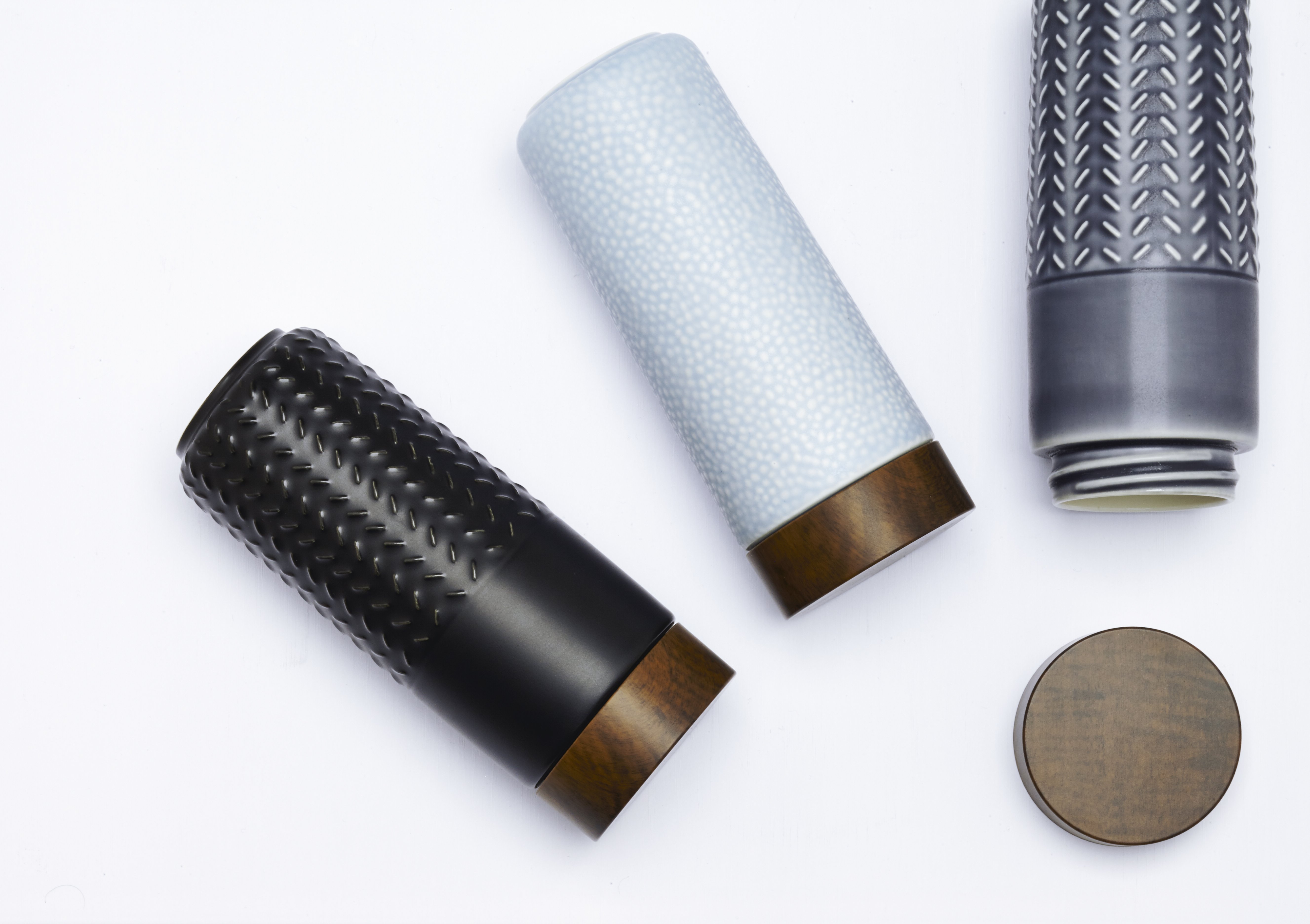 One-O-One Flying to the Clouds Tumbler showcasing its embossed checkered design, available in six trendy colors with a walnut wood-effect lid.