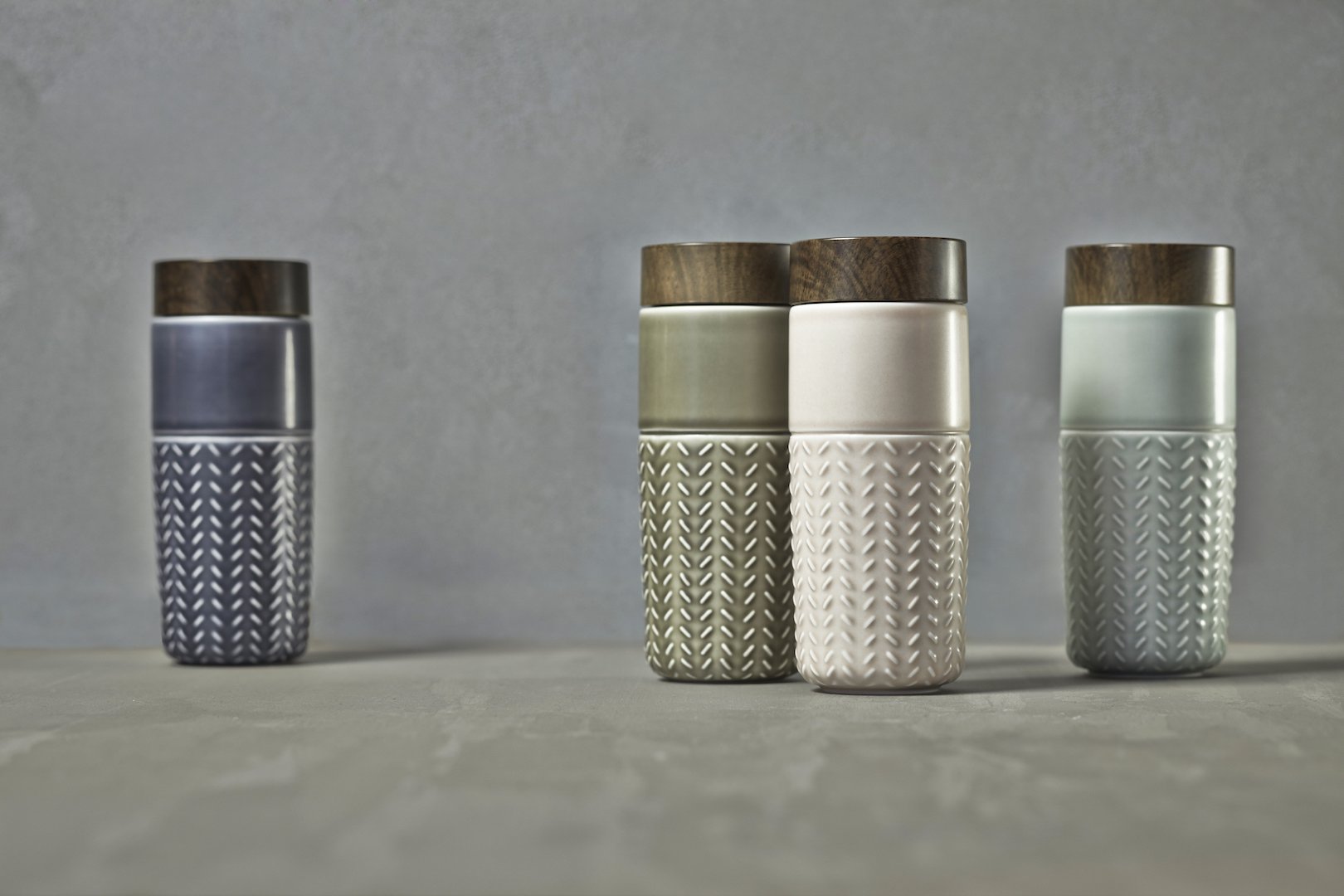 One-O-One Flying to the Clouds Tumbler showcasing its embossed checkered design, available in six trendy colors with a walnut wood-effect lid.