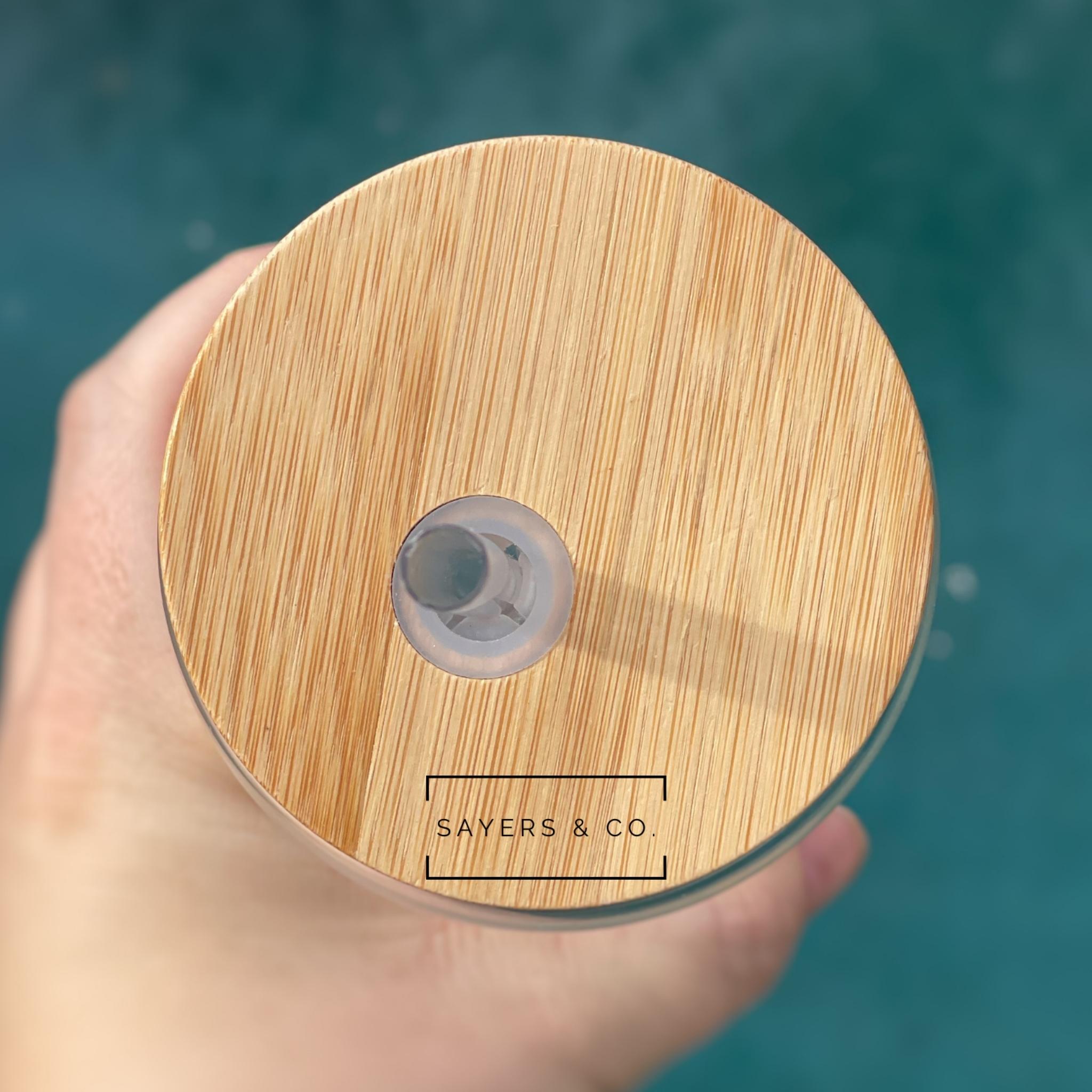 Pack of 10 sublimation glass cans with bamboo lids and straws, showcasing their clear design and eco-friendly features.