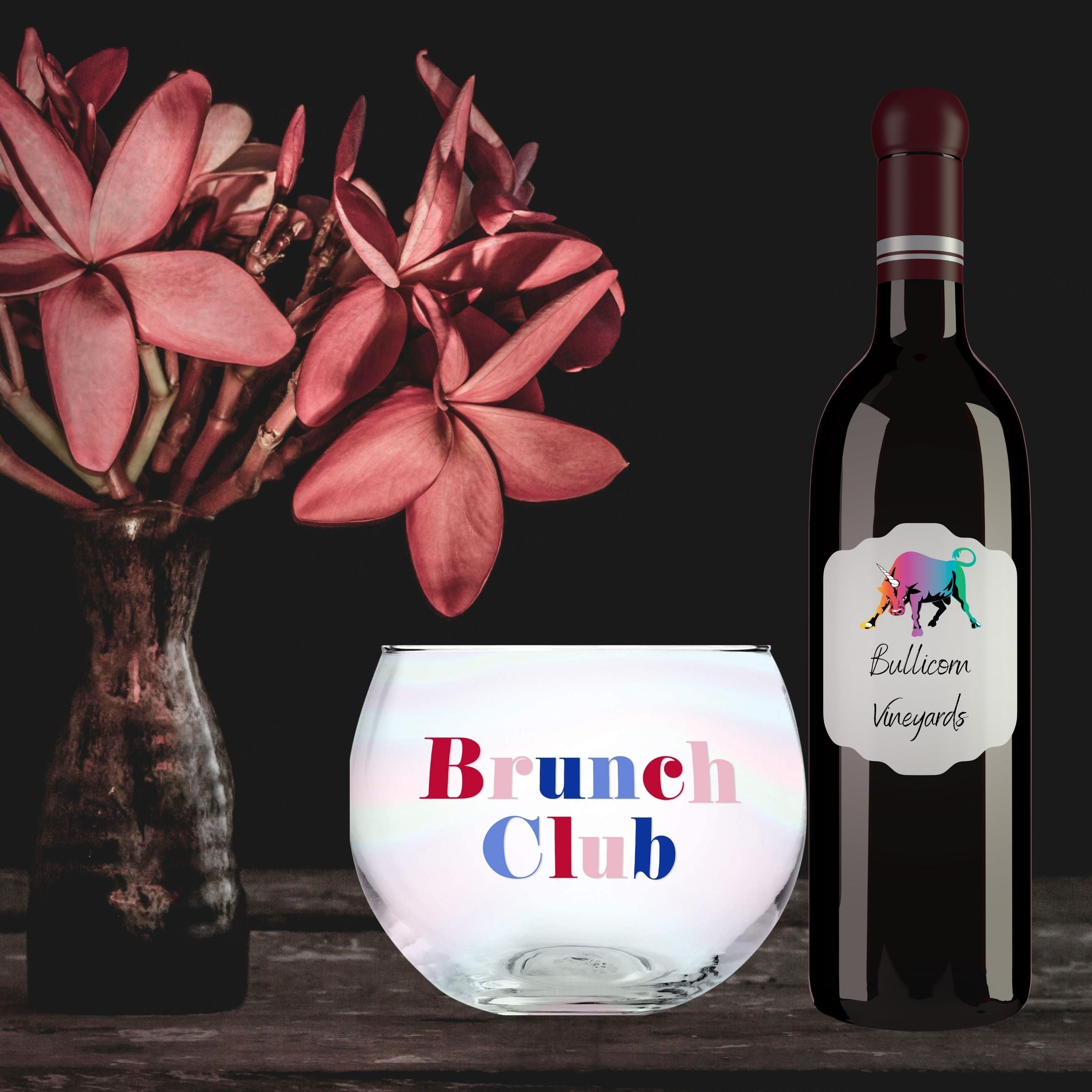 A set of six clear glass roly poly cocktail glasses with colorful 'Brunch Club' lettering, perfect for brunch gatherings.