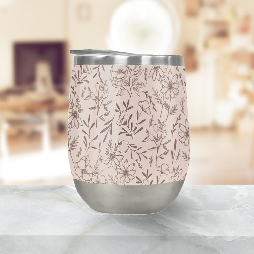 A stylish pink flower stemless wine tumbler made of stainless steel, perfect for outdoor use.
