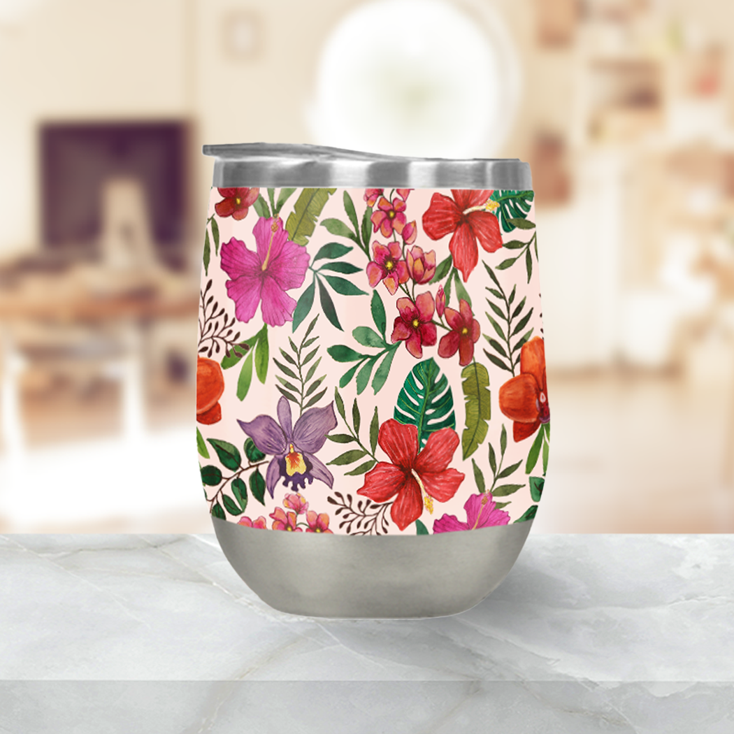 Pink Tropical Flower Stemless Wine Tumbler with double-wall insulation and plastic lid, perfect for outdoor use.