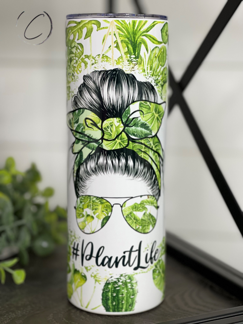 Plantlife 20oz Skinny Tumbler with vibrant full wrap design and reusable straw, perfect for hot and cold beverages.
