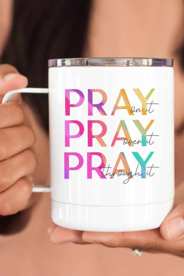 A stylish 12 oz stainless steel travel mug with the phrase 'Pray On it Over It Through It' printed on both sides, featuring a secure lid.
