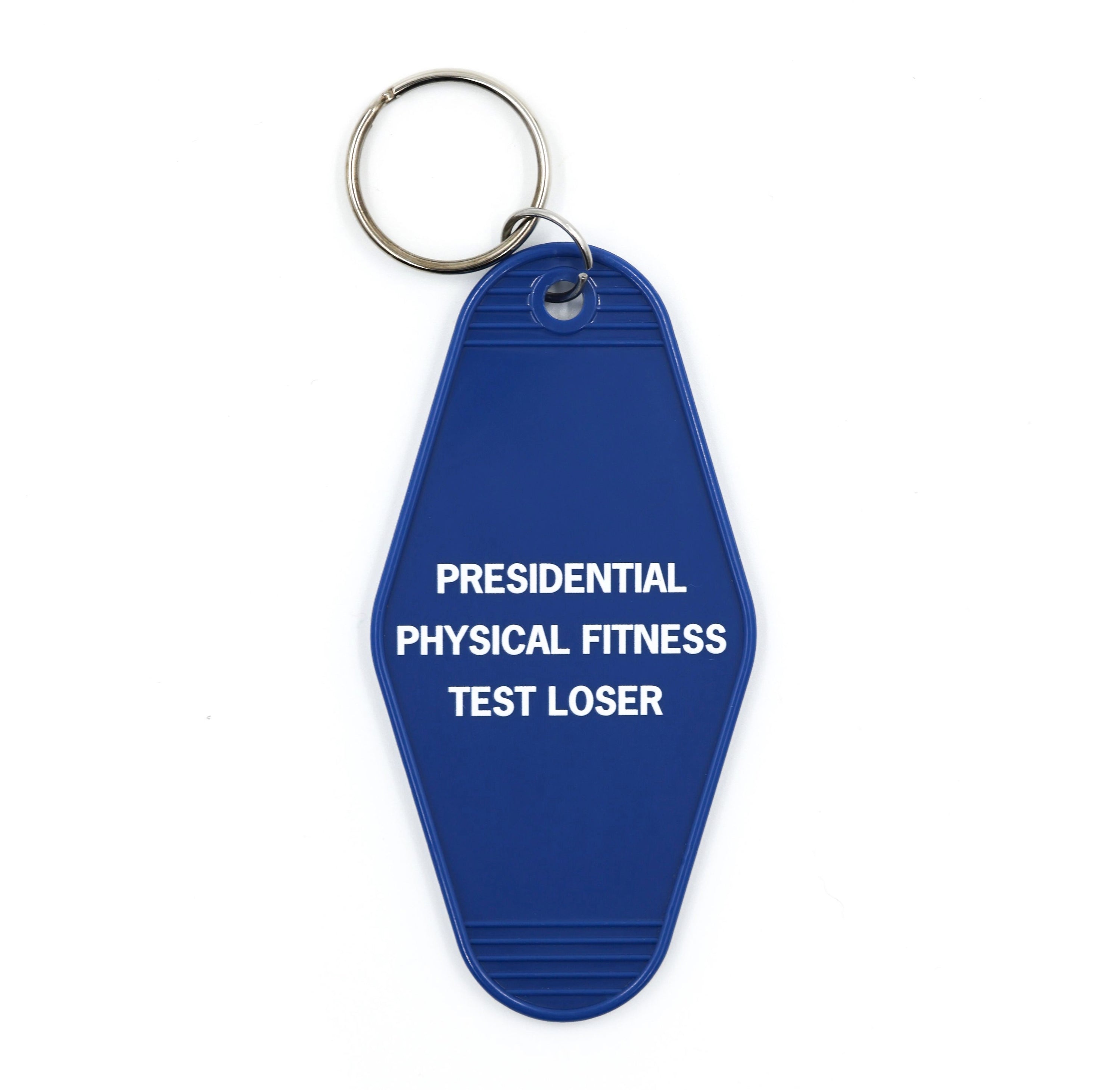 Blue motel-style keychain with white lettering reading 'PRESIDENTIAL PHYSICAL FITNESS TEST LOSER'.