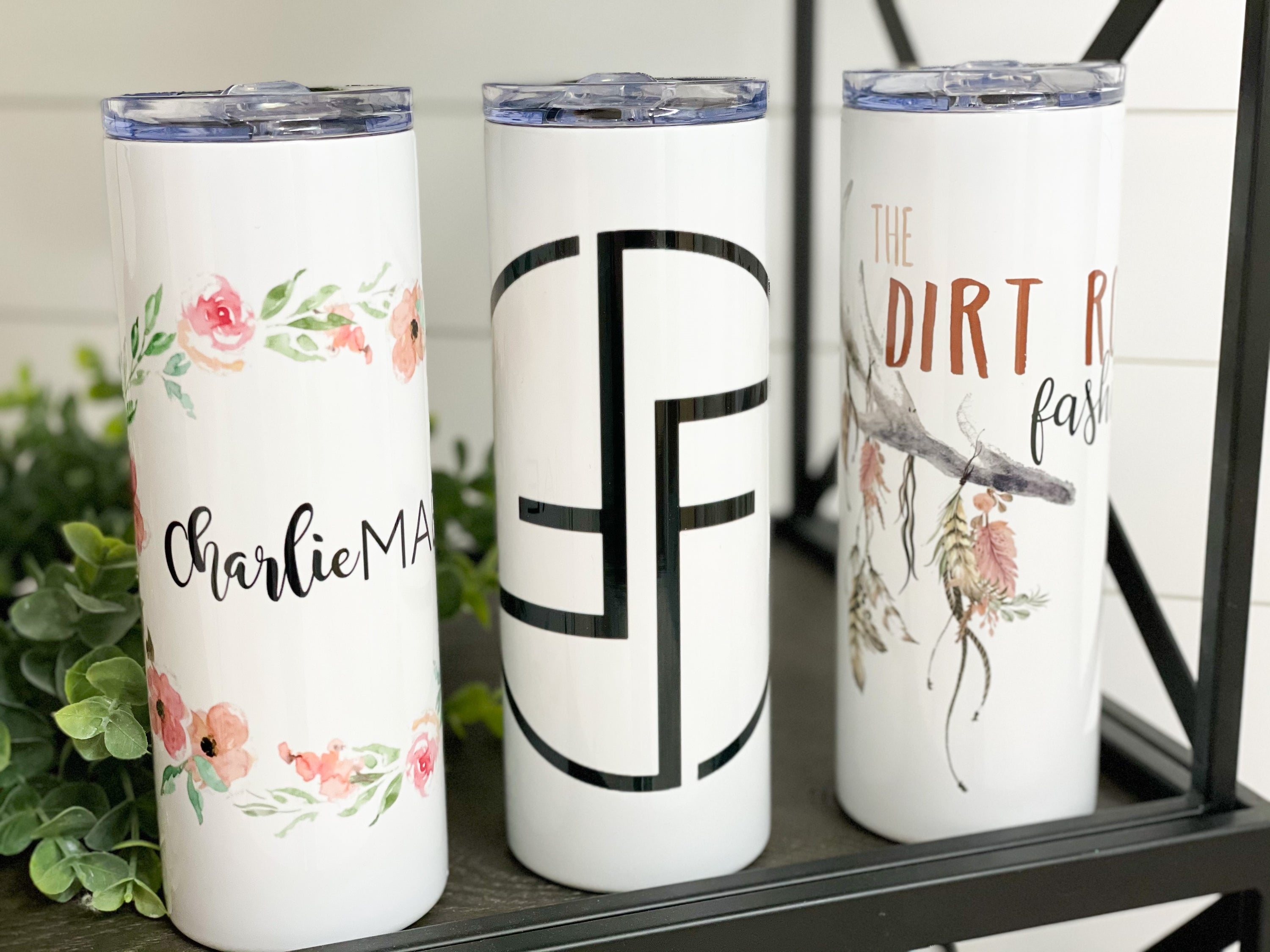 A sleek 20oz skinny tumbler with a custom logo, reusable straw, and double-wall insulation, perfect for hot and cold beverages.