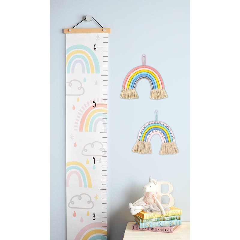 Colorful Rainbow Kids Growth Chart hanging on a wall, measuring 65 inches long with a vibrant design.