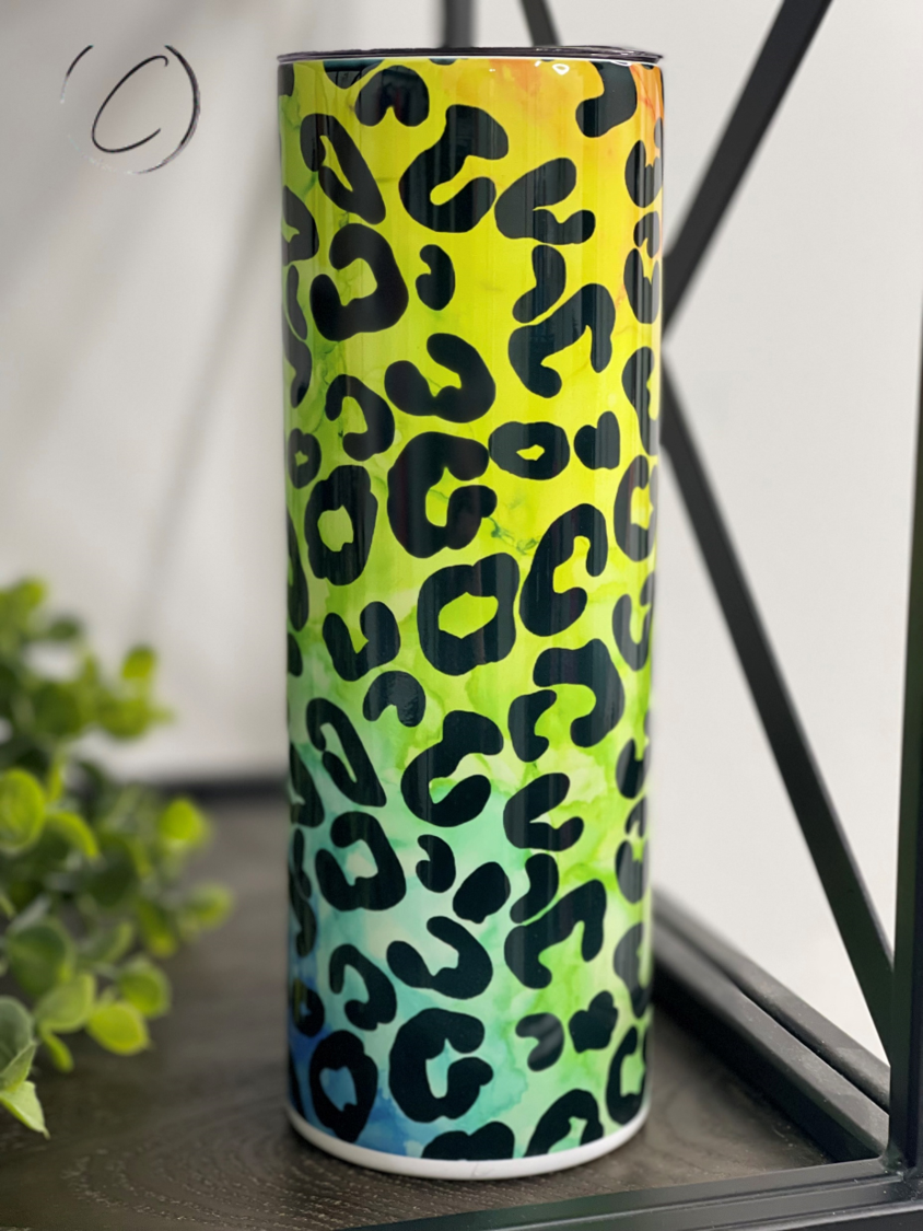 Rainbow Leopard 20oz Skinny Tumbler featuring a vibrant leopard print design, perfect for hot and cold beverages.