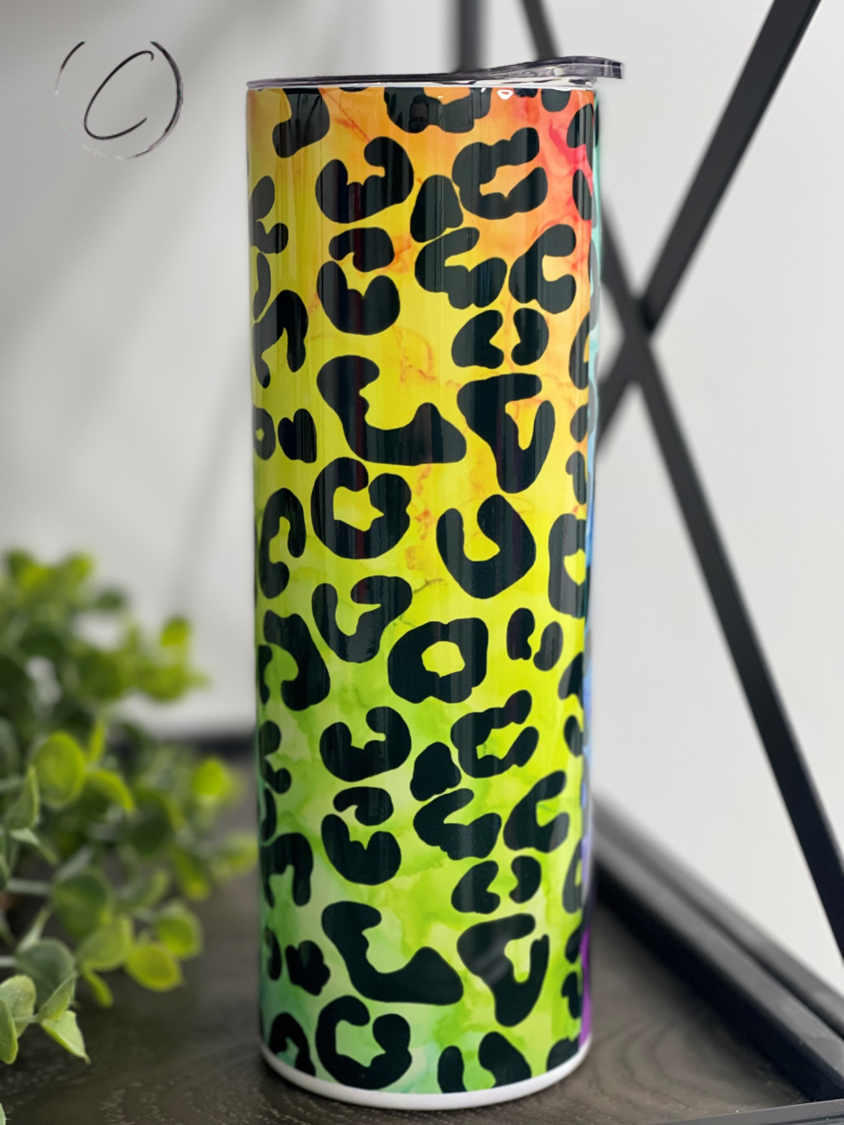 Rainbow Leopard 20oz Skinny Tumbler featuring a vibrant leopard print design, perfect for hot and cold beverages.