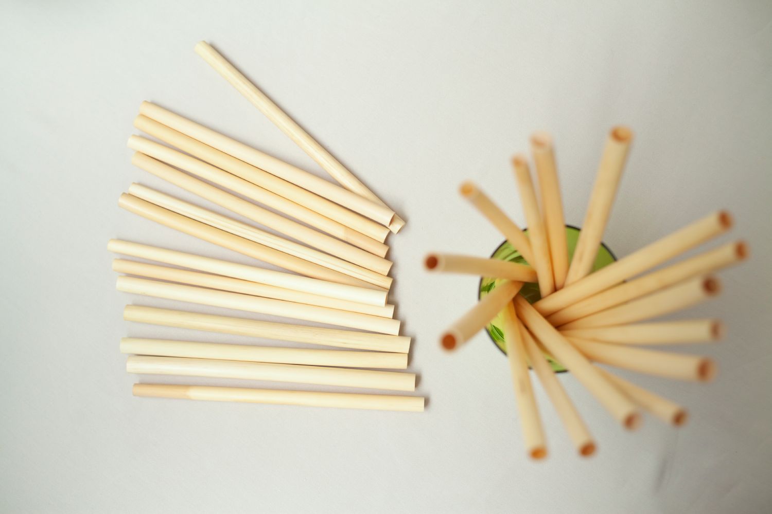 A bundle of large reed straws, showcasing their natural beige color and eco-friendly design, ideal for smoothies and beverages.