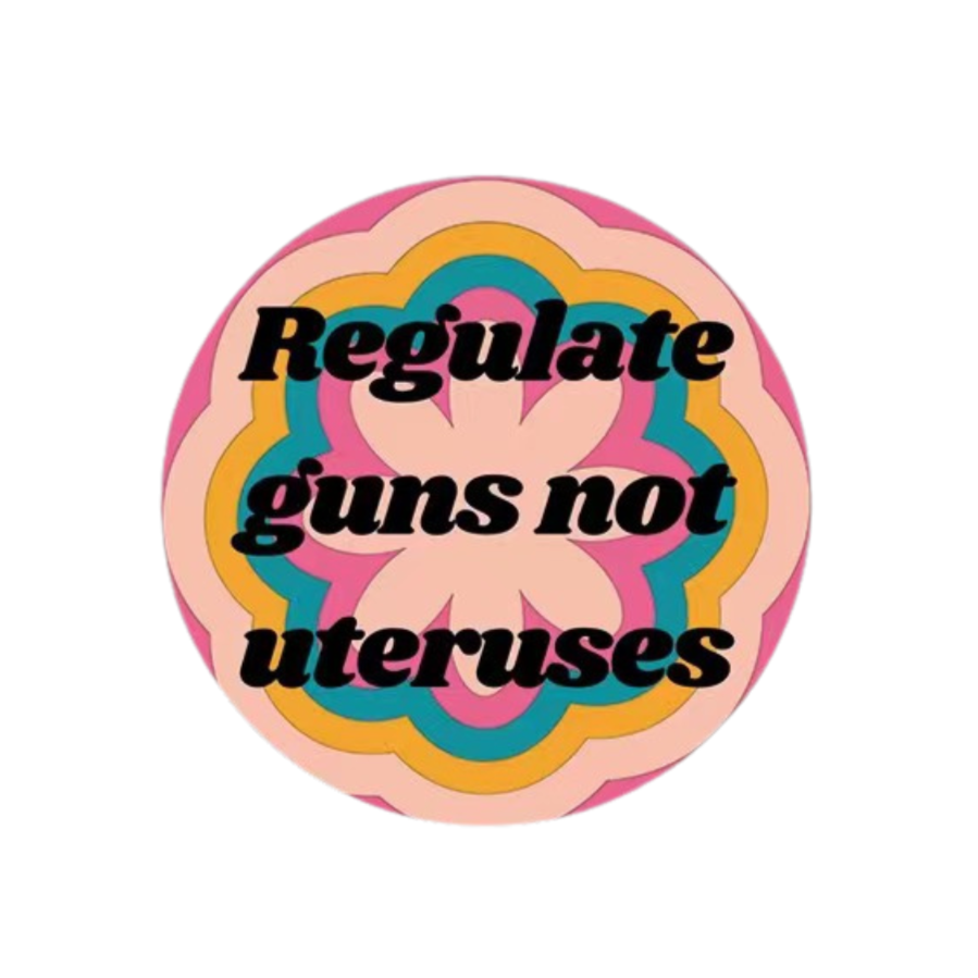 1.25-inch button featuring the phrase 'Regulate Guns Not Uteruses' with a colorful groovy flower design.