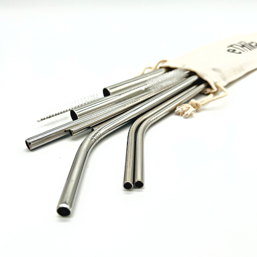 Set of reusable stainless steel straws in a mini cotton pouch with a cleaning brush.