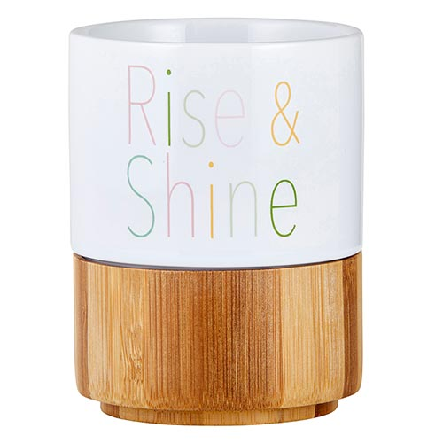 Rise & Shine Ceramic Mug with Bamboo Base featuring multicolored lettering and a natural bamboo base for storage.