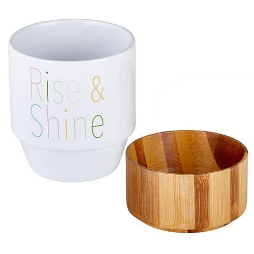 Rise & Shine Ceramic Mug with Bamboo Base featuring multicolored lettering and a natural bamboo base for storage.