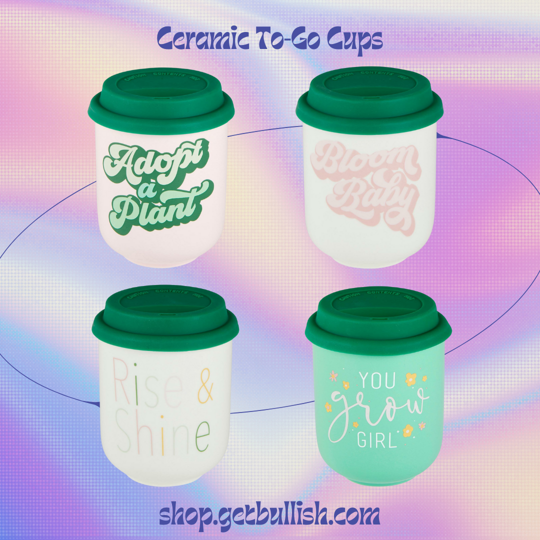 Rise & Shine Ceramic To Go Mug with silicone lid and sleeve, featuring multicolored lettering on a white background.