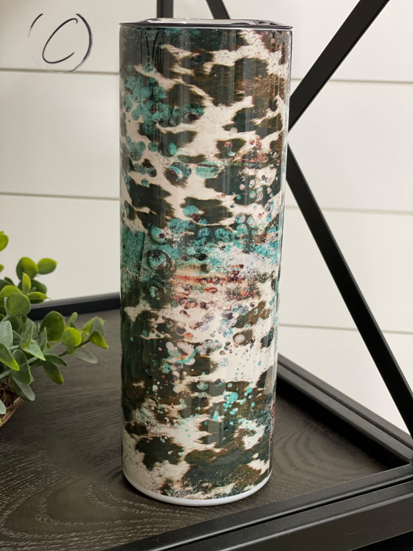 Rustic Cowhide 20oz Skinny Tumbler with a unique full wrap design, featuring a reusable straw and durable construction.