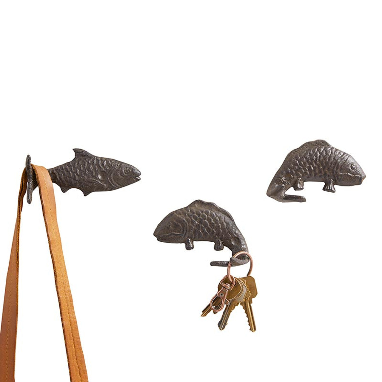 Set of 3 decorative fish-shaped cast iron wall hooks, perfect for coastal decor, showcasing a whimsical design.