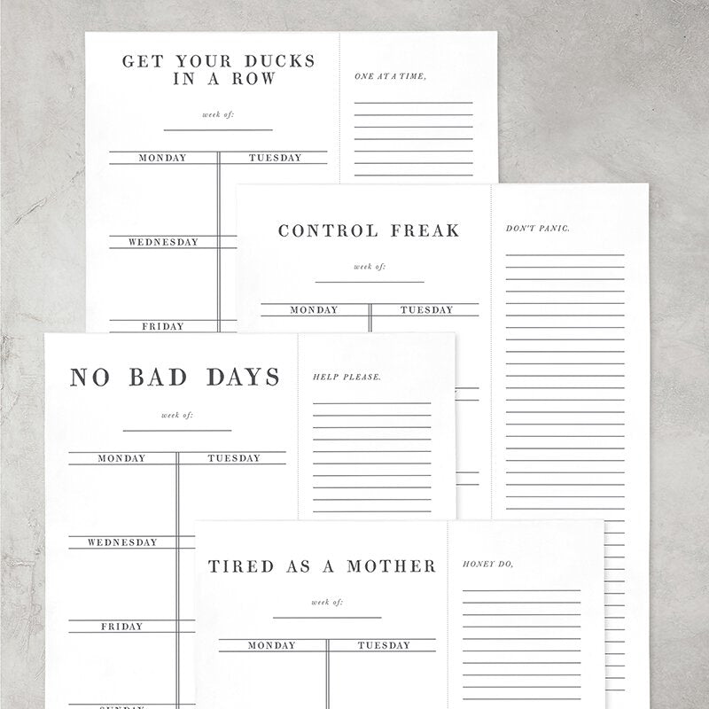 Control Freak Weekly List Notepad featuring sections for daily tasks and meal planning, designed in a stylish black and white layout.