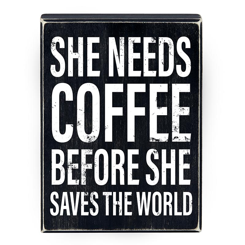 Wooden decor box sign with the phrase 'She Needs Coffee Before She Saves The World', featuring a stylish design suitable for home decor.