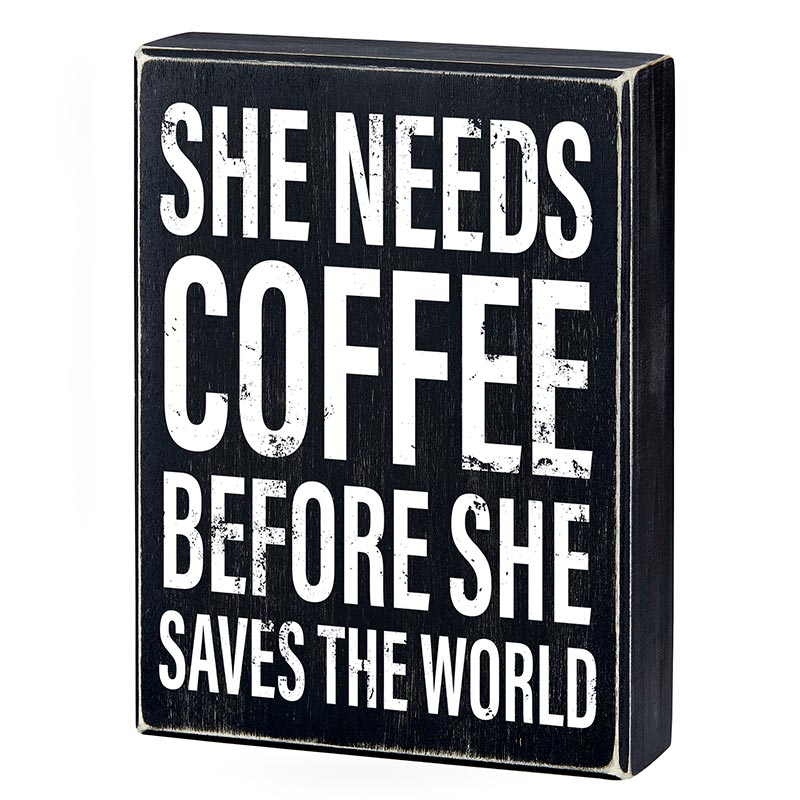Wooden decor box sign with the phrase 'She Needs Coffee Before She Saves The World', featuring a stylish design suitable for home decor.