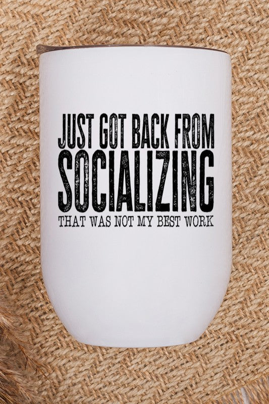 A stainless steel wine tumbler with a humorous graphic saying 'Socializing Not My Best Work', featuring a lid and straw.